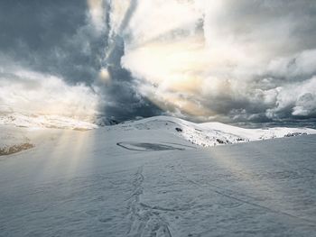 Scenic view of snow covered mountain against sky