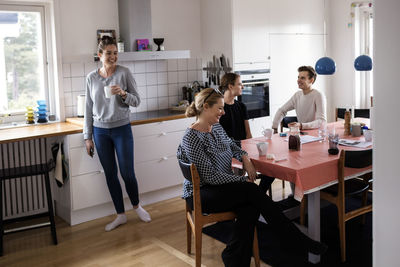 Happy family spending leisure time in kitchen of new home