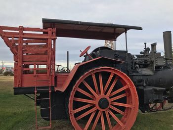 View of tractor on field against sky