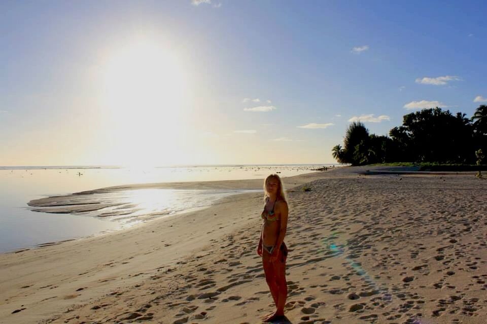 beach, sand, leisure activity, shore, lifestyles, sunlight, sea, sky, sun, water, full length, vacations, tranquil scene, tranquility, beauty in nature, scenics, nature, standing