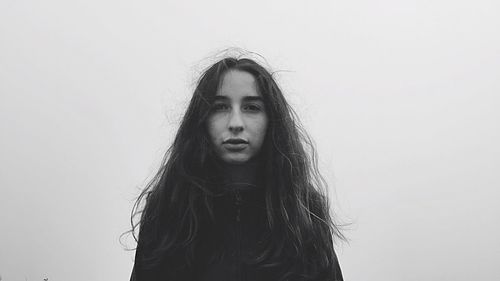 Close-up of a young woman over white background