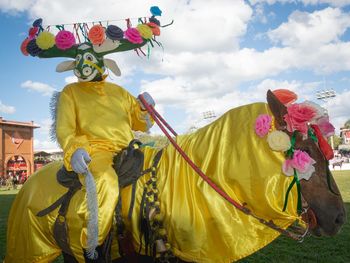 Panoramic view of yellow sculpture against sky