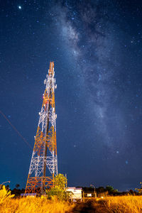 Low angle view of tower against sky at night