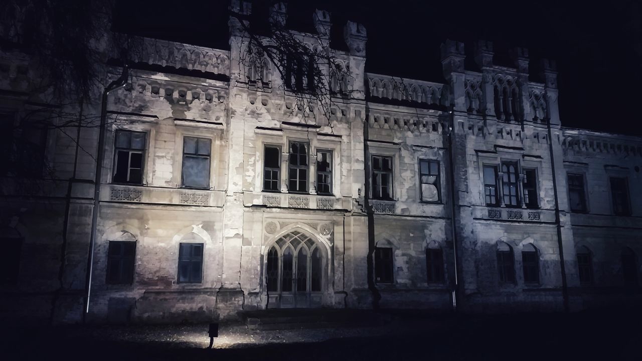 EXTERIOR OF OLD BUILDING AT NIGHT