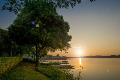 Scenic view of lake against sky during sunset