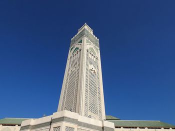 Low angle view of historical building against blue sky