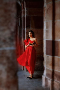 Young woman smiling while sitting on staircase