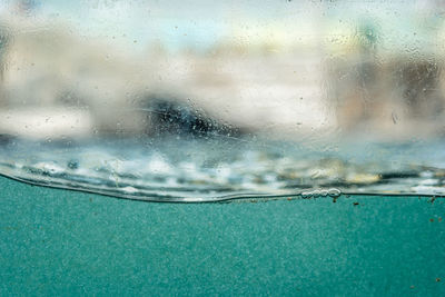 Close-up of wet window in rainy season