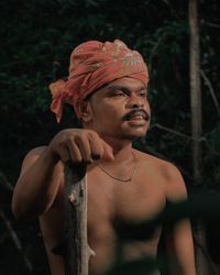 Portrait of young man looking away