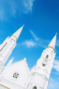 Low angle view of built structure against blue sky