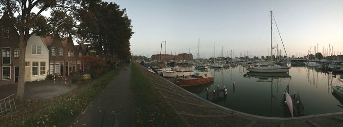 Boats moored at harbor