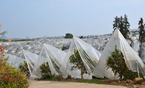 Panoramic view of tent on field against clear sky
