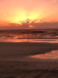 Scenic view of sea against romantic sky at sunset