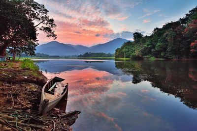 Scenic view of lake against sky during sunset
