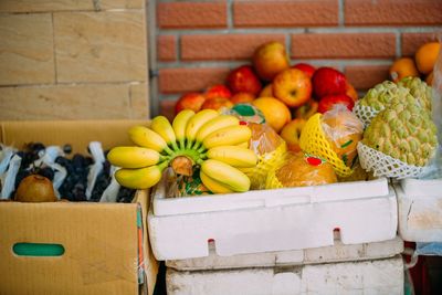 Various fruits in crate at market stall