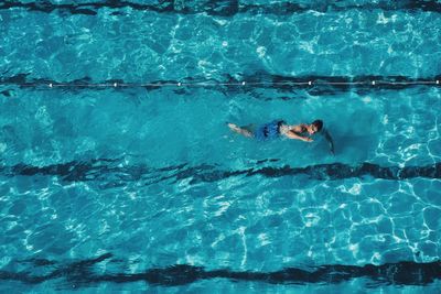 High angle view of man swimming in pool