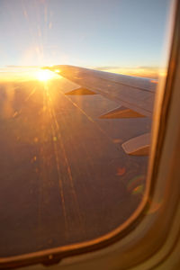 View of sunset through airplane window
