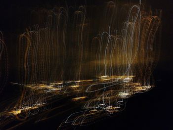 Full frame shot of illuminated lights against black background