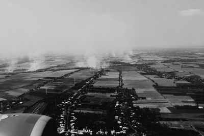 High angle view of cars on landscape against sky