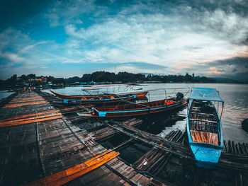 Boats moored at harbor