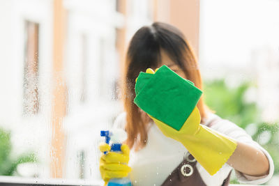 Woman holding toy at home