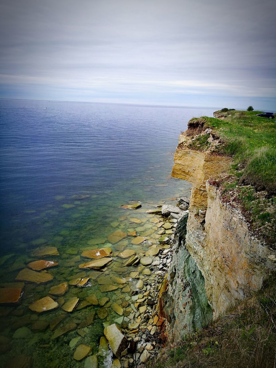 sea, water, horizon over water, nature, scenics, tranquility, tranquil scene, rock - object, beauty in nature, outdoors, no people, day, sky, cliff