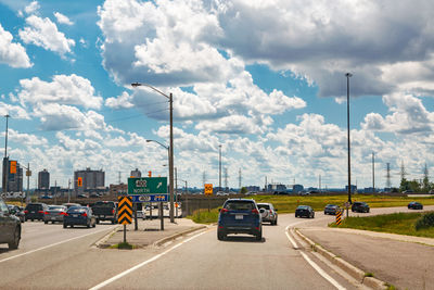 Beautiful landscape midday view of toronto city highway street with cars traffic during sunny day 