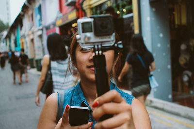 Woman photographing through smart phone