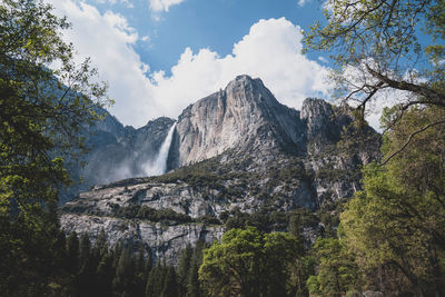 Low angle view of mountain range against sky in yosemite 