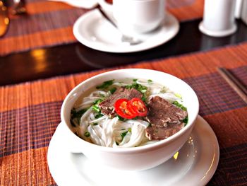 High angle view of soup served in bowl on table