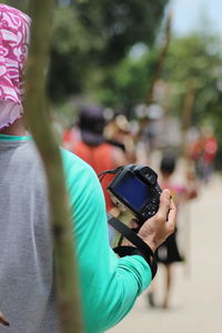 Man photographing with mobile phone