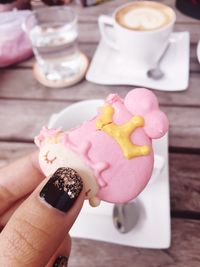 Close-up of woman hand holding cookie