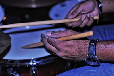 Close-up of man playing guitar