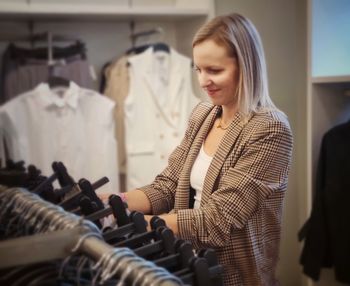 Young woman standing at store