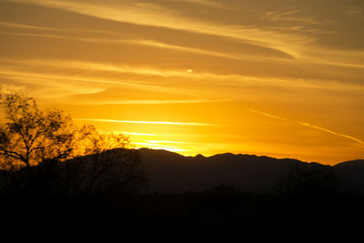 Scenic view of silhouette landscape against sky during sunset