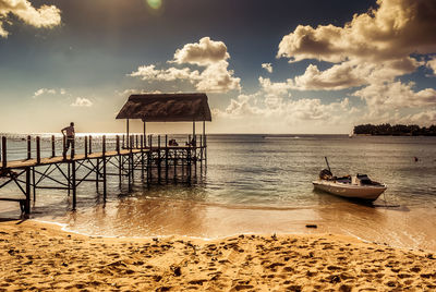 Scenic view of sea against cloudy sky