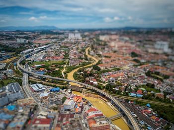 Aerial view of cityscape against sky