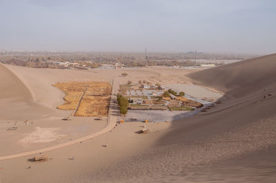 Aerial view of desert against sky