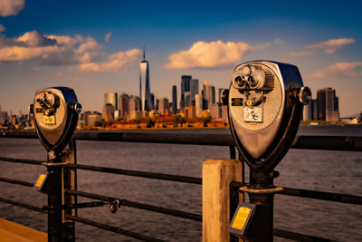 Close-up of binoculars against sky