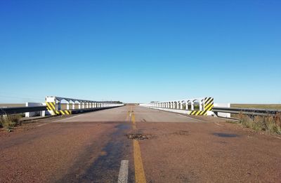 View of bridge against clear blue sky