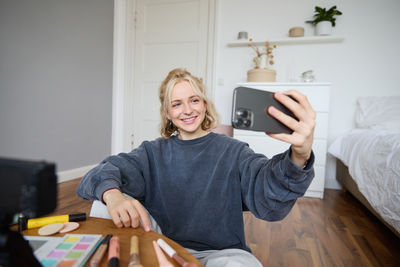 Young woman using mobile phone