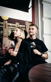 Young couple looking at camera