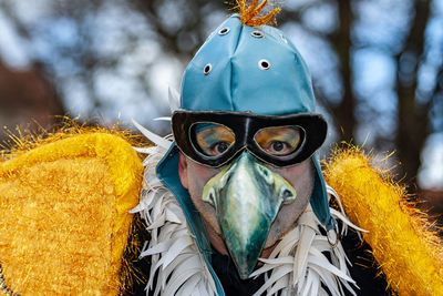 Close-up portrait of man wearing mask