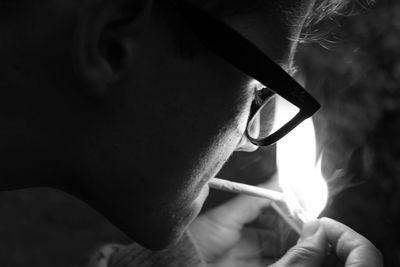 Close-up of man holding eyeglasses