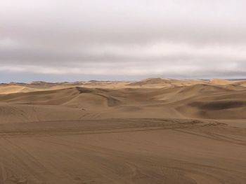 Scenic view of desert against sky