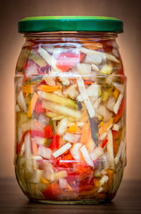 Close-up of jar over white background