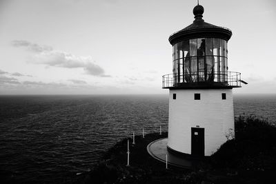 High angle view of lighthouse by sea against sky