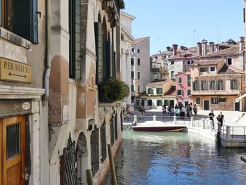 View of swimming pool by buildings in city