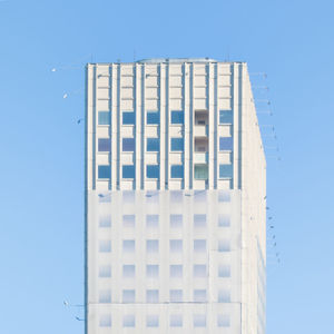 Low angle view of building against blue sky