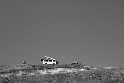 Car on land against clear sky